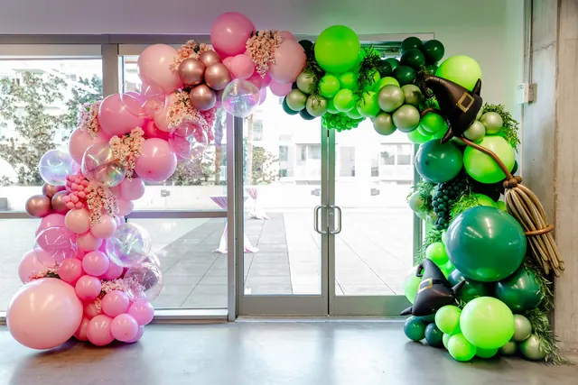 Pink and green balloon arch at the 2025 Goodness Gala