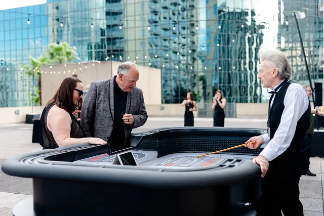 Guests gathered around a rooftop game table at the 2026 Goodness Gala