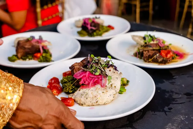 Plated dinners being prepared for service at the 2026 Goodness Gala