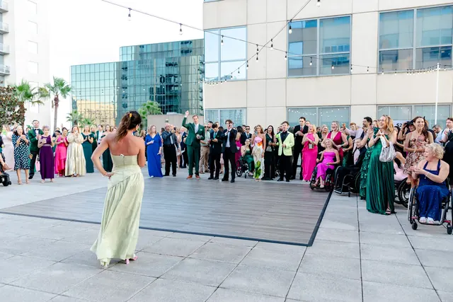 Performer entertaining guests gathered on the rooftop at the 2025 Goodness Gala