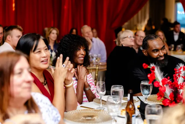 Dinner guests applauding at the 2026 Goodness Gala