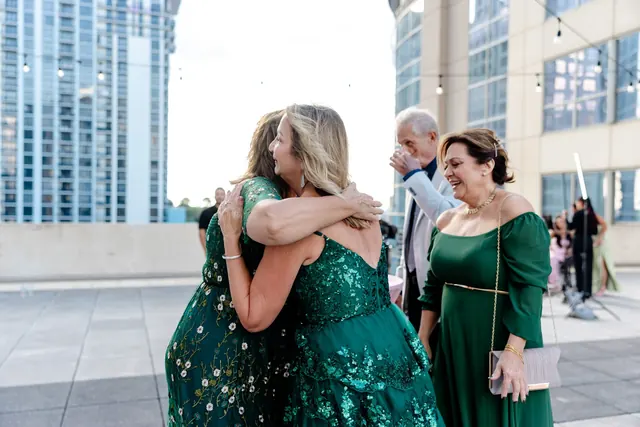 Guests greeting each other on the rooftop at the 2025 Goodness Gala
